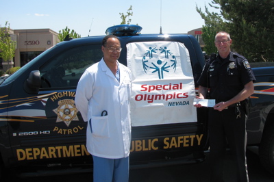 Dr. Morgan presents check for Special Olympics